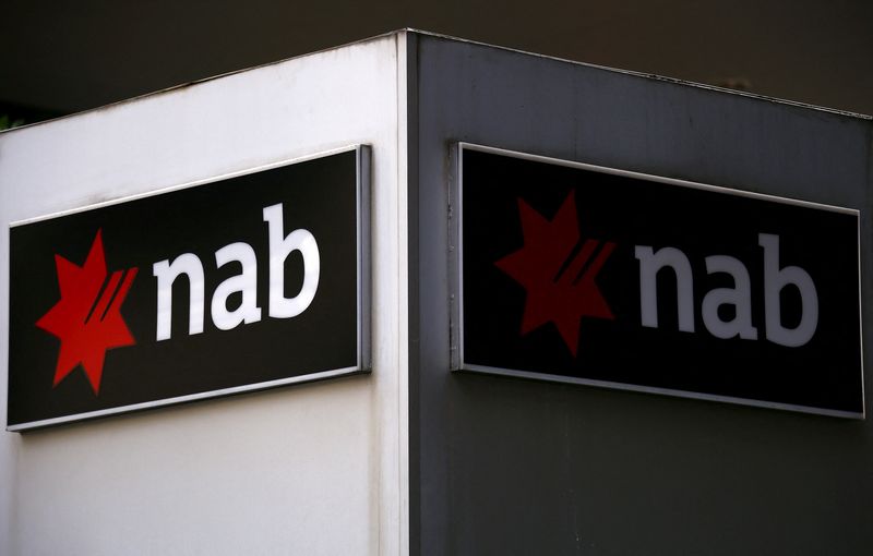 FILE PHOTO: A National Australia Bank (NAB) sign is displayed outside an office building in central Sydney, Australia