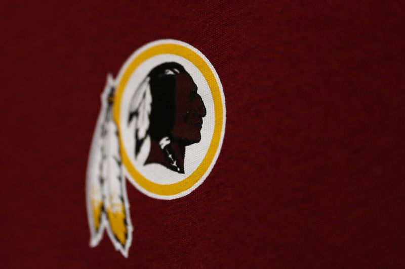 FILE PHOTO: Washington Redskins branded merchandise sits on display in a sports store in Virginia