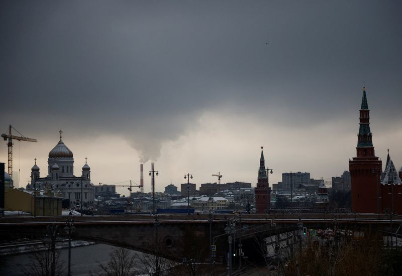 FILE PHOTO: Steam rises from chimneys of a heating power plan over the skyline of central Moscow