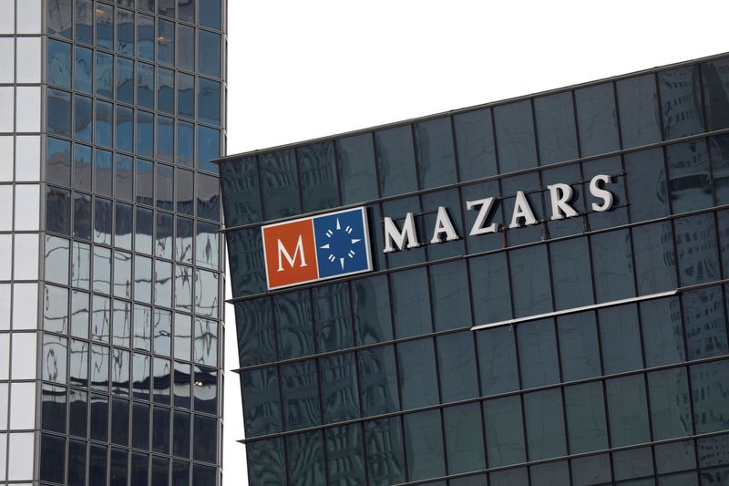 FILE PHOTO: The logo of Mazars, an international, integrated organisation, that is specialised in audit, accounting, tax and advisory services is seen on a building in the financial district of la Defense near Paris