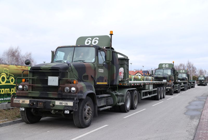 U.S. Military vehicles are parked outside the G2A Arena near the Rzeszow-Jasionka Airport