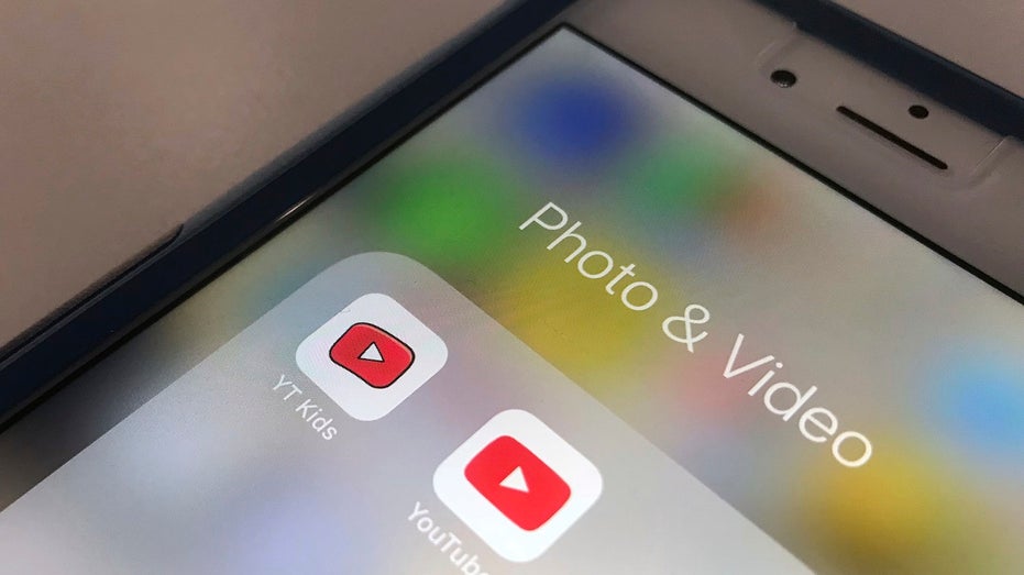 YouTube app and YouTube Kids app are displayed on an iPhone in New York.