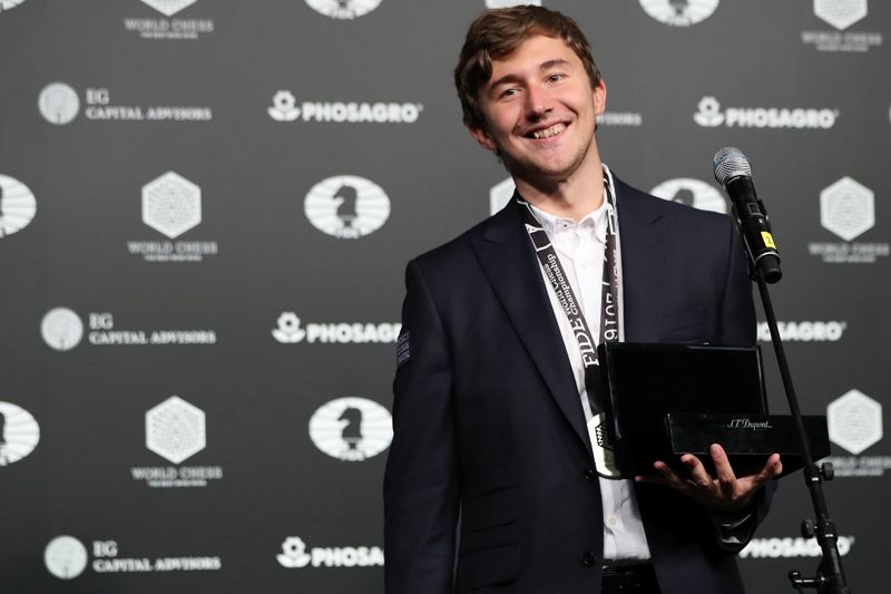 Sergey Karjakin of Russia smiles after being cheered by fans after losing at the 2016 World Chess Championship match in New York