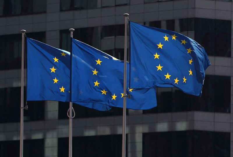 FILE PHOTO: European Union flags fly outside the European Commission headquarters in Brussels