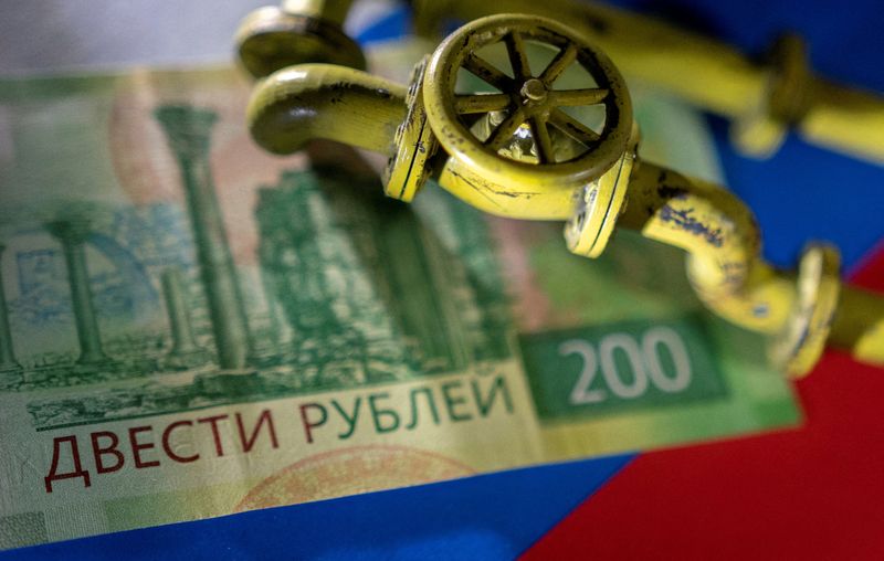 FILE PHOTO: llustration shows natural gas pipeline, Russian rouble banknote and flag