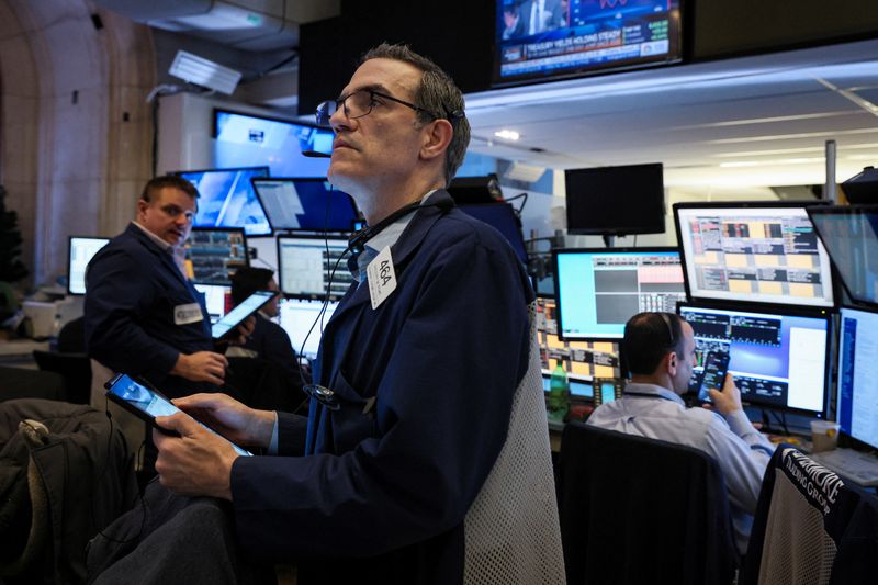 Traders work on the floor of the NYSE in New York