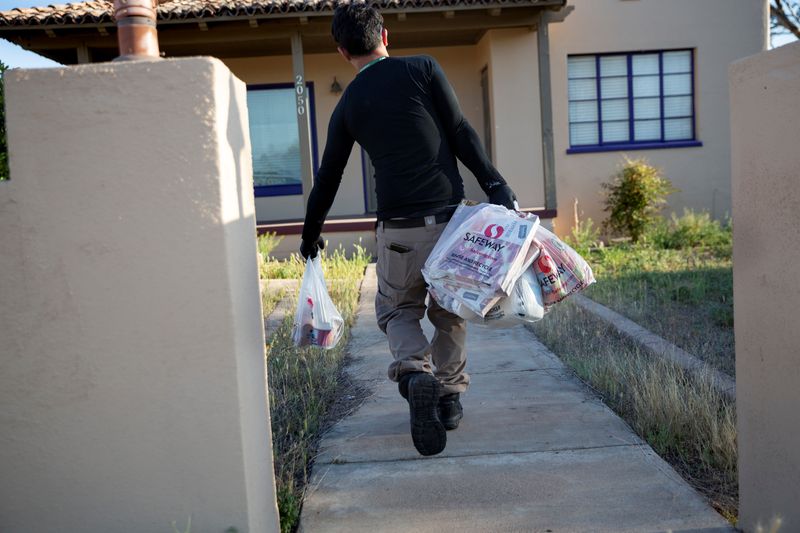 Instacart employee Eric Cohn works amid the coronavirus outbreak