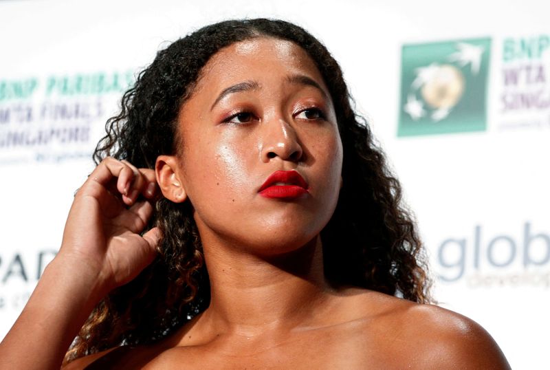 FILE PHOTO: Naomi Osaka of Japan arrives for the singles draw ceremony of the WTA Tennis Finals in Singapore