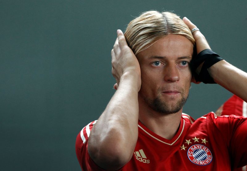 FILE PHOTO: Tymoshchuk reacts during photo call in Munich