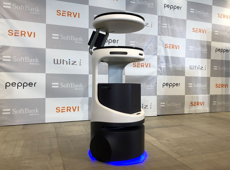 FILE PHOTO: SoftBank's robotics arm displays a food service robot Servi, developed for restaurants grapple with labour shortages and seek to ensure social distancing during the coronavirus disease (COVID-19) outbreak, in T