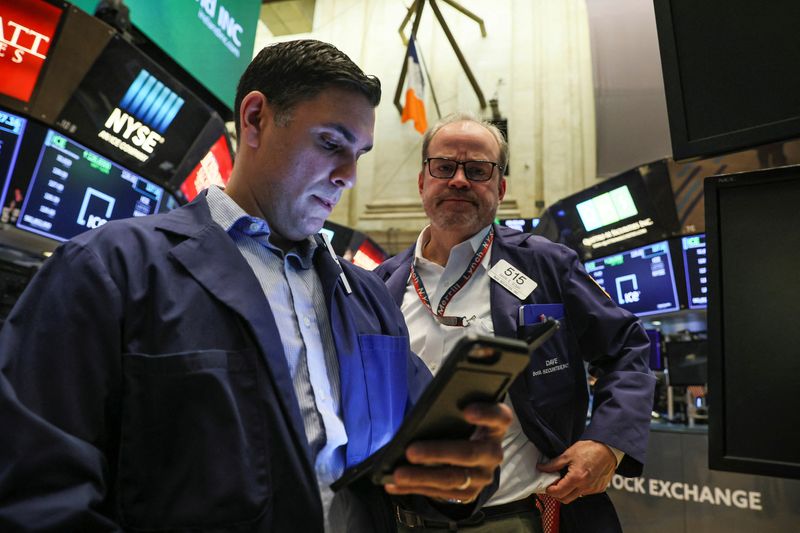 Traders work on the floor of the NYSE in New York