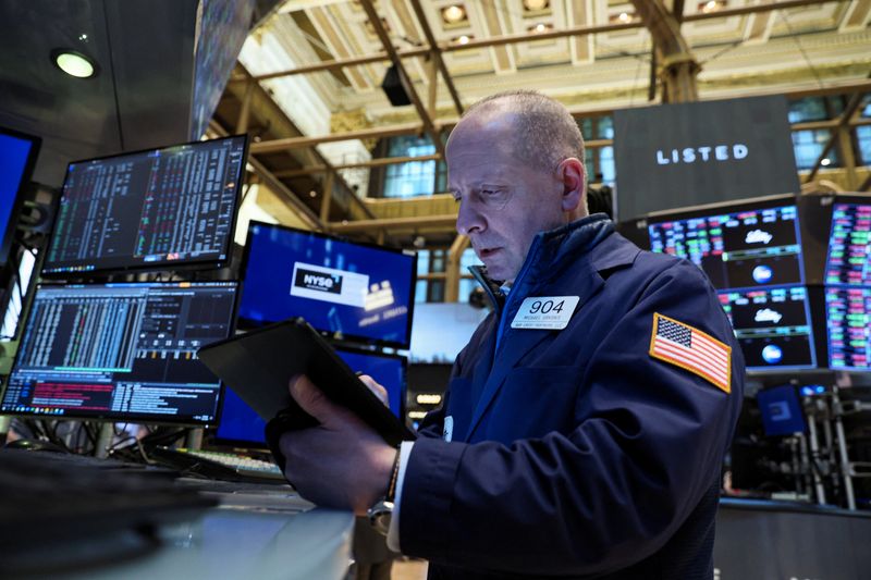 Traders work on the floor of the NYSE in New York