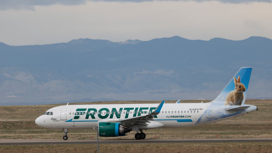 In this April 23, 2020 photo a Frontier Airlines jetliner taxis to a runway for take off from Denver International Airport in Denver. Lawmakers on Capitol Hill lashed out Wednesday, May 6, 2020 against Frontier Airlines over the budget carrier's move to charge passengers extra to guarantee they will sit next to an empty middle seat while flying during the coronavirus outbreak. (AP Photo/David Zalubowski)