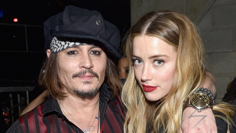 Johnny Depp and Amber Heard at The 58th GRAMMY Awards