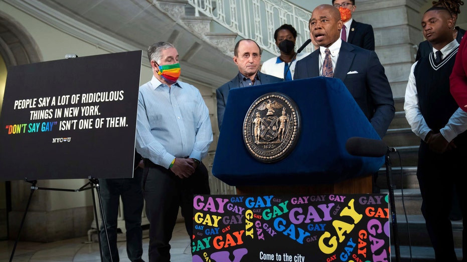 New York City Mayor Eric Adams stands at the podium during a news conference.