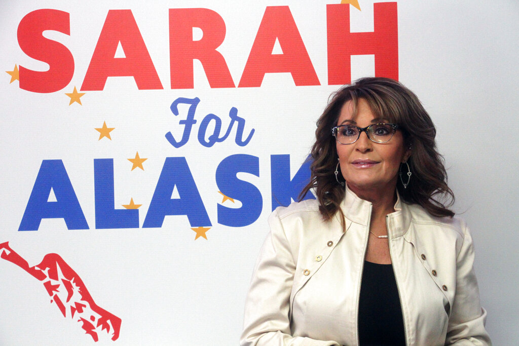 Former Alaska Gov. Sarah Palin addresses supporters at the opening of her new campaign headquarters in Anchorage, Alaska, on Wednesday, April 20, 2022. Palin, the first Republican female vice presidential nominee, is among 48 candidates running for the Alaska's lone seat in the U.S. House following the death last month of Republican Rep. Don Young, who held the job for 49 years. (AP Photo/Mark Thiessen)