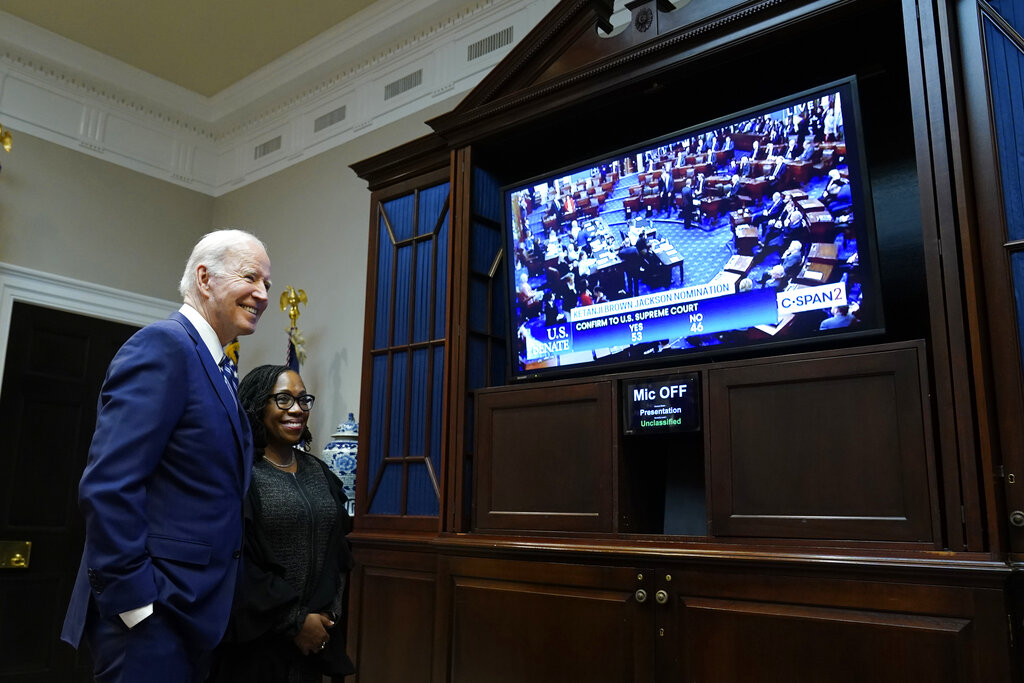 President Joe Biden and Supreme Court nominee Judge Ketanji Brown Jackson watch as the Senate votes on her confirmation from the Roosevelt Room of the White House in Washington, Thursday, April 7, 2022. (AP Photo/Susan Walsh)
