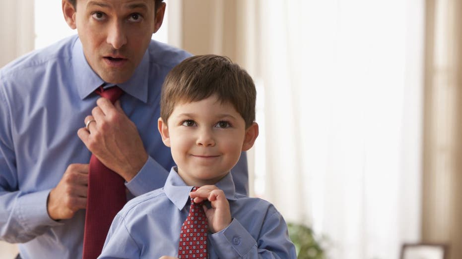 Father and son fix their ties