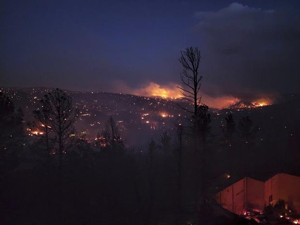 Wildfires rage in West, destroying homes and forcing thousands to evacuate