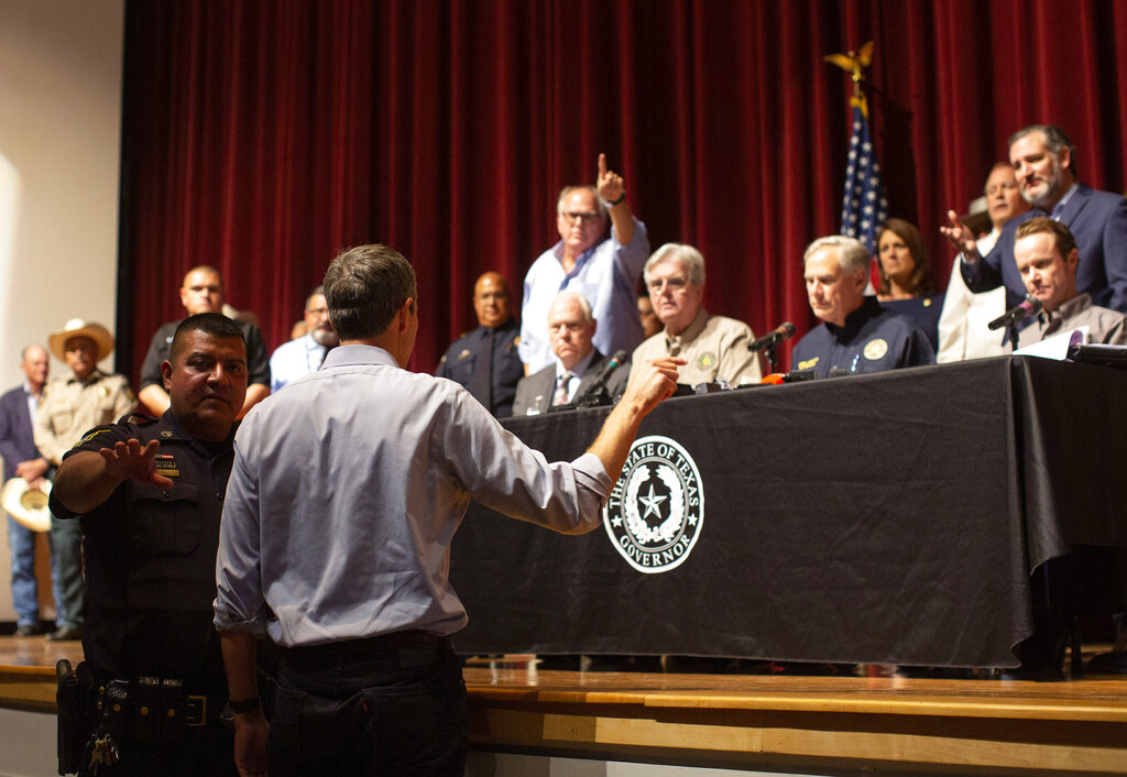 Democrat Beto O'Rourke, who is running against Texas Gov. Greg Abbott for governor this year, interrupts a news conference headed by Abbott in Uvalde, Texas Wednesday, May 25, 2022. (AP Photo/Dario Lopez-Mills)