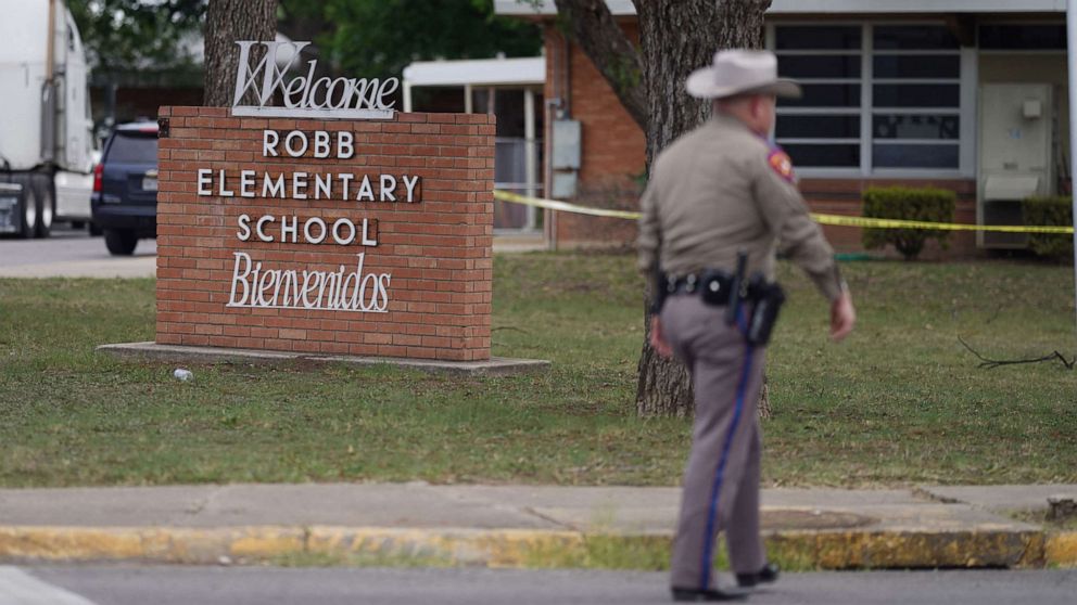 PHOTO: An officer walks outside of Robb Elementary School in Uvalde, Texas, May 24, 2022. 