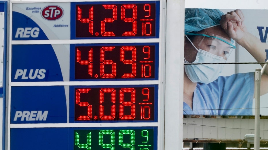 High gas prices are seen in front of a medical billboard Wednesday, May 11, 2022, in Milwaukee.