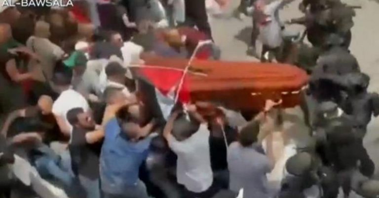 Israeli police beat mourners at journalist’s funeral