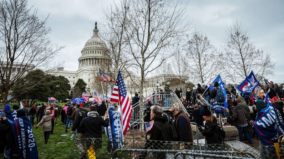 PHOTO: A large group of pro-Trump protesters overtake police and barriers in order to access the Capitol Building on January 6, 2021 in Washington, DC.