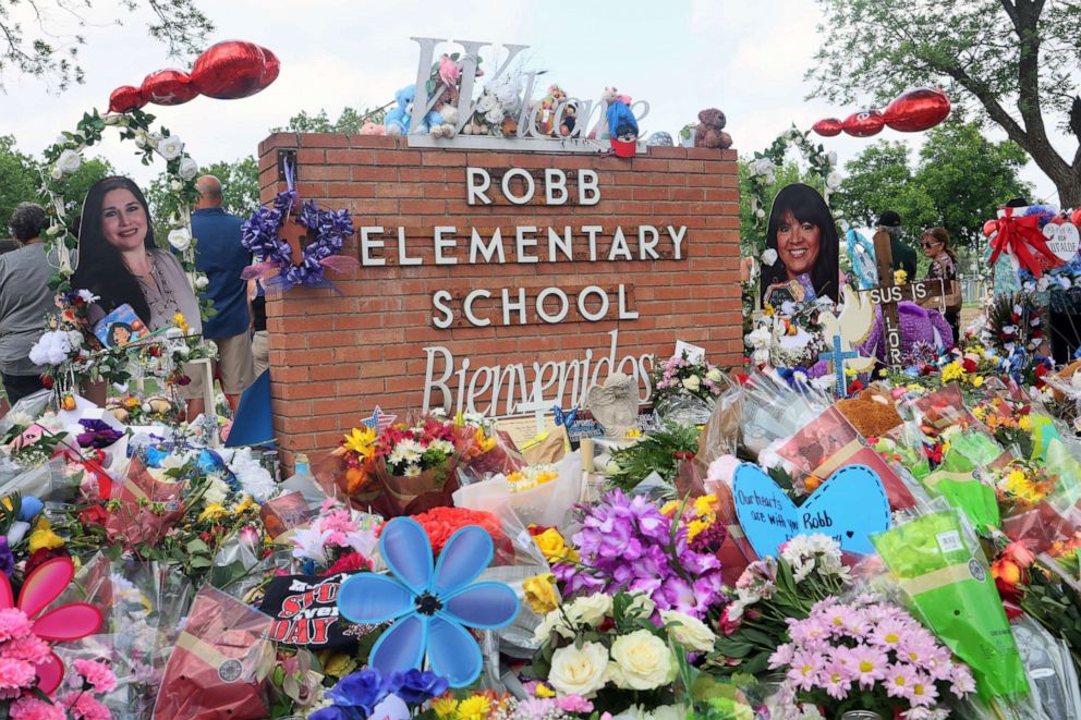 PHOTO: People visit a memorial for the 19 children and two adults killed on May 24th during a mass shooting at Robb Elementary School on May 30, 2022, in Uvalde, Texas.