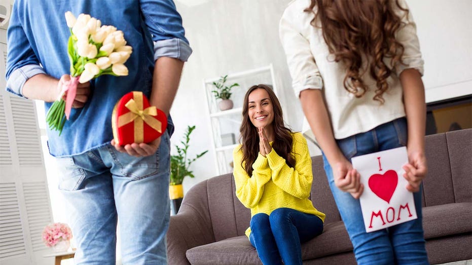 Husband and daughter giving mom gifts