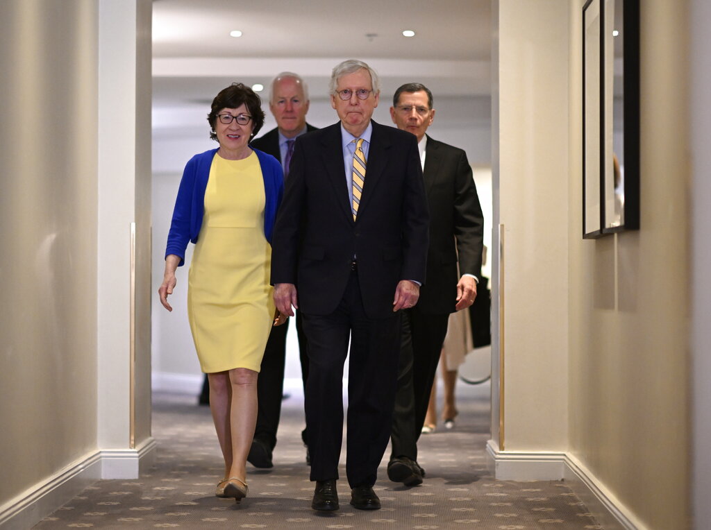 U.S. Republican Sens. Mitch McConnell, center, and from left, Susan Collins, John Cornyn and John Barrasso prepare to meet with Swedish media at the Grand Hotel in Stockholm after a meeting with Swedish Prime Minister Magdalena Andersson and Minister of Defense Peter Hultqvist on Sunday, May 15, 2022. McConnell said Sunday that Finland and Sweden would be “important additions” to NATO as he led a delegation of GOP senators to the region in a show of support against Russia's aggression. (Anders Wiklund/TT News Agency via AP)