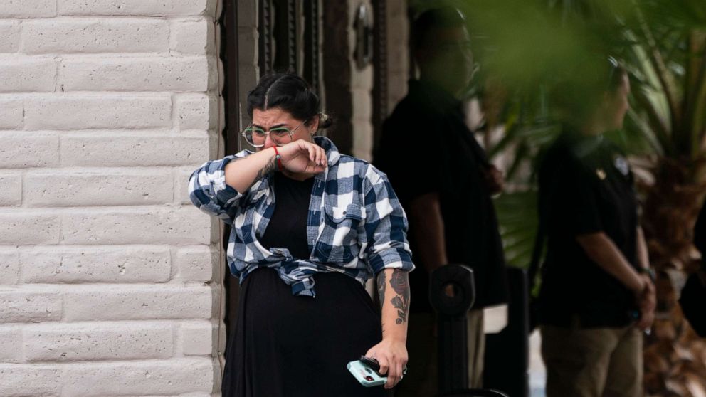 PHOTO: A woman weeps as she leaves a funeral home after attending a visitation for Nevaeh Bravo, one of the victims killed in last week's Robb Elementary School shooting, in Uvalde, Texas, May 31, 2022.