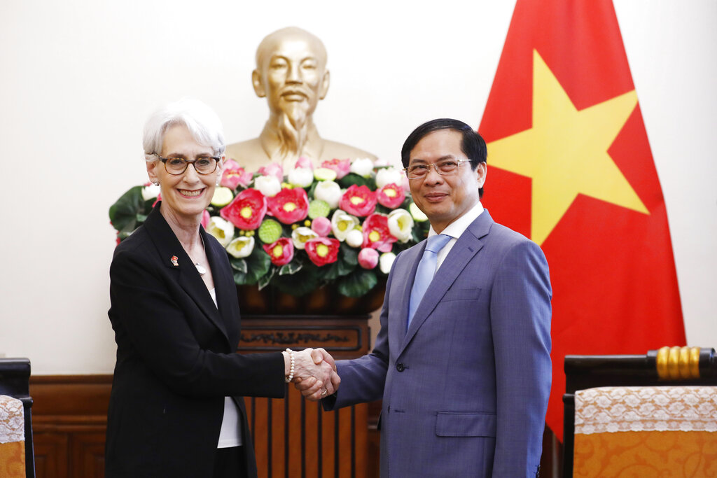 U.S. Deputy Secretary of State Wendy Sherman shakes hands with Vietnamese Foreign Minister Bui Thanh Son in Hanoi, Vietnam, on Monday, June 13, 2022. Sherman is visiting Vietnam, the last stop in her Asian trip after South Korea, the Philippines and Laos. (AP Photo/Hoang Duong)