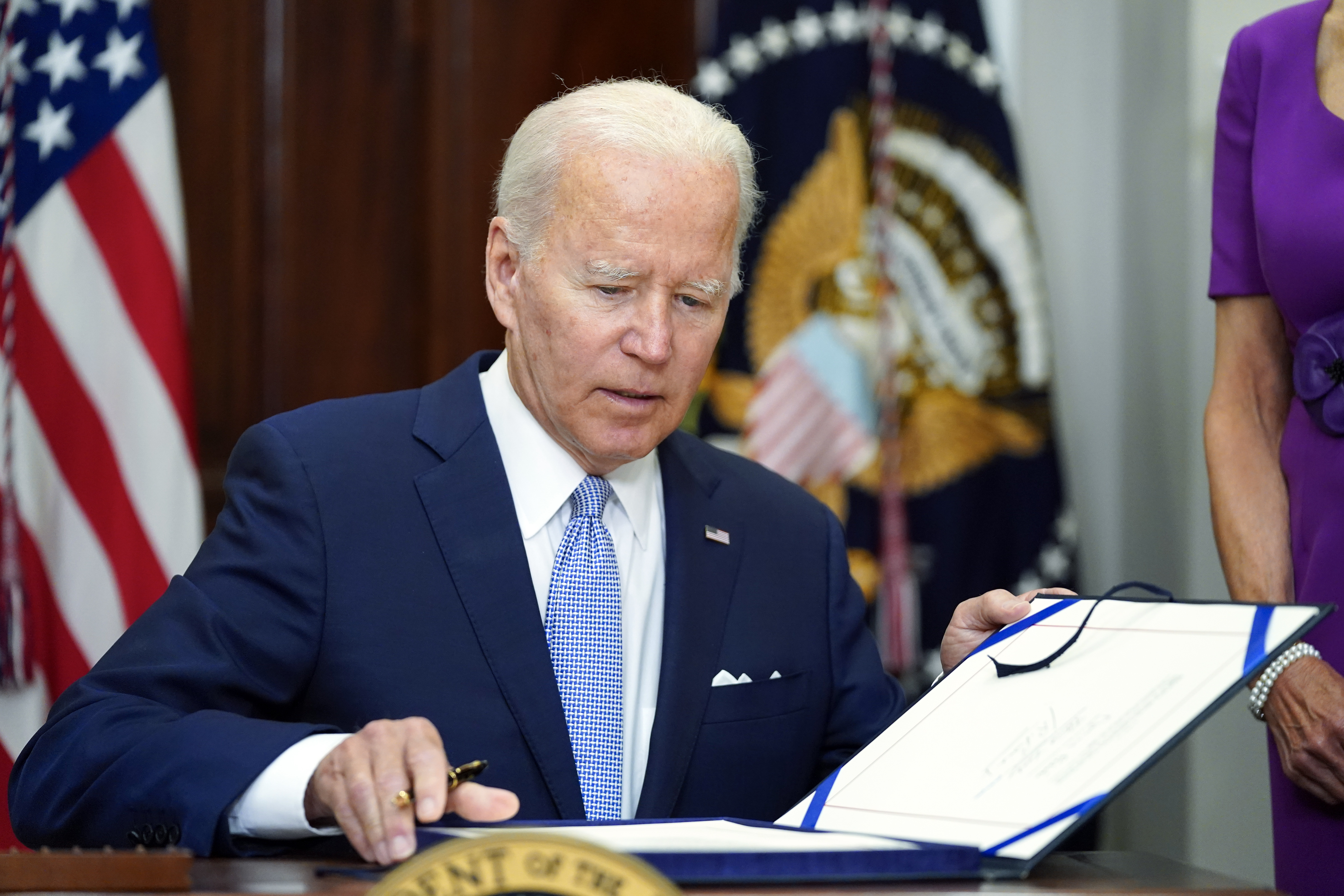 President Joe Biden signs into law S. 2938, the Bipartisan Safer Communities Act gun safety bill, in the Roosevelt Room of the White House in Washington, Saturday, June 25, 2022. (AP Photo/Pablo Martinez Monsivais)