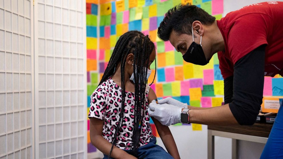 PHOTO: In this May 19, 2022, file photo, a doctor puts a band-aid on a 5-year-old after receiving a COVID-19 booster vaccine at Skippack Pharmacy in Schwenksville, Pa.