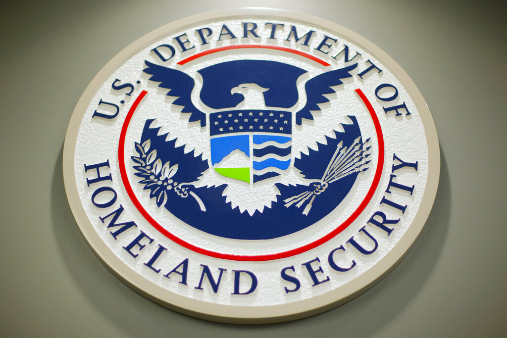FILE - The Department of Homeland Security logo is seen during a news conference in Washington, Feb. 25, 2015. DHS says a looming Supreme Court decision on abortion, an increase of migrants at the U.S.-Mexico border and the midterm elections are potential triggers for extremist violence over the next six months. DHS said June 7, 2022, in the National Terrorism Advisory System bulletin the U.S. was in a "heightened threat environment" already and these factors may worsen the situation. (AP Photo/Pablo Martinez Monsivais, File)