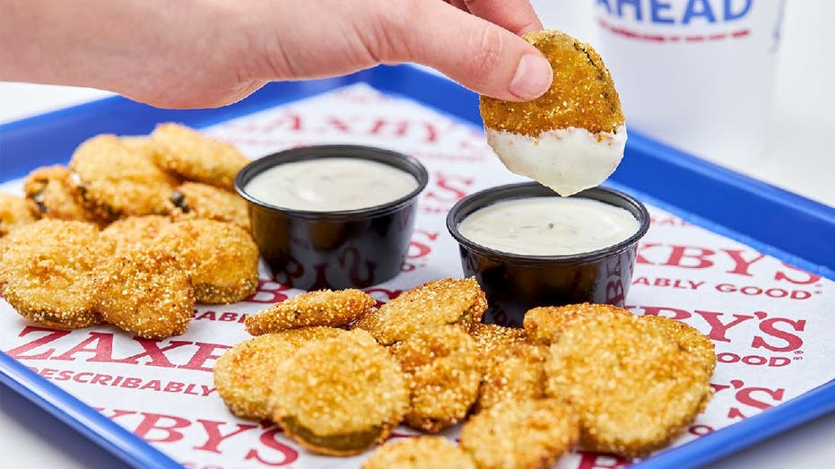 Zaxby's fried pickles dipped in sauce