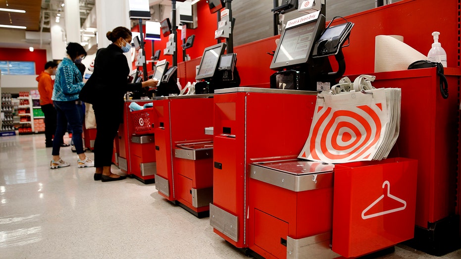 People buy stuff at Target self-checkout