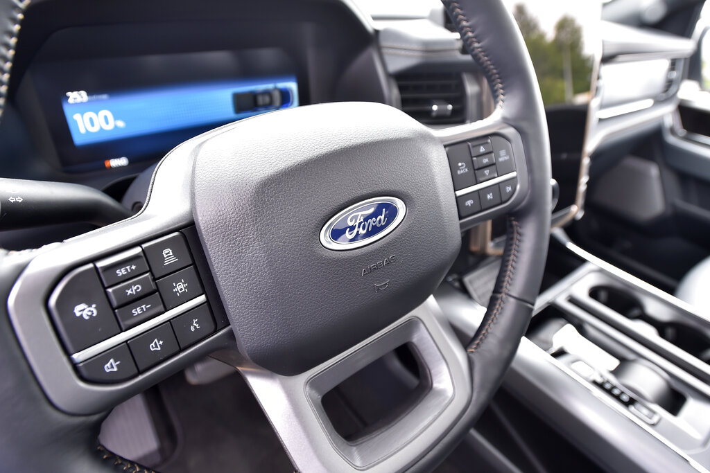 A view of the inside of a 2022 Ford F-150 Lightning all-electric truck taken during a press conference, Thursday, June 2, 2022, in Avon Lake, Ohio. Ford announced it will add 6,200 factory jobs in Michigan, Missouri and Ohio as it prepares to build more electric vehicles and roll out two redesigned combustion-engine models. (AP Photo/David Richard)