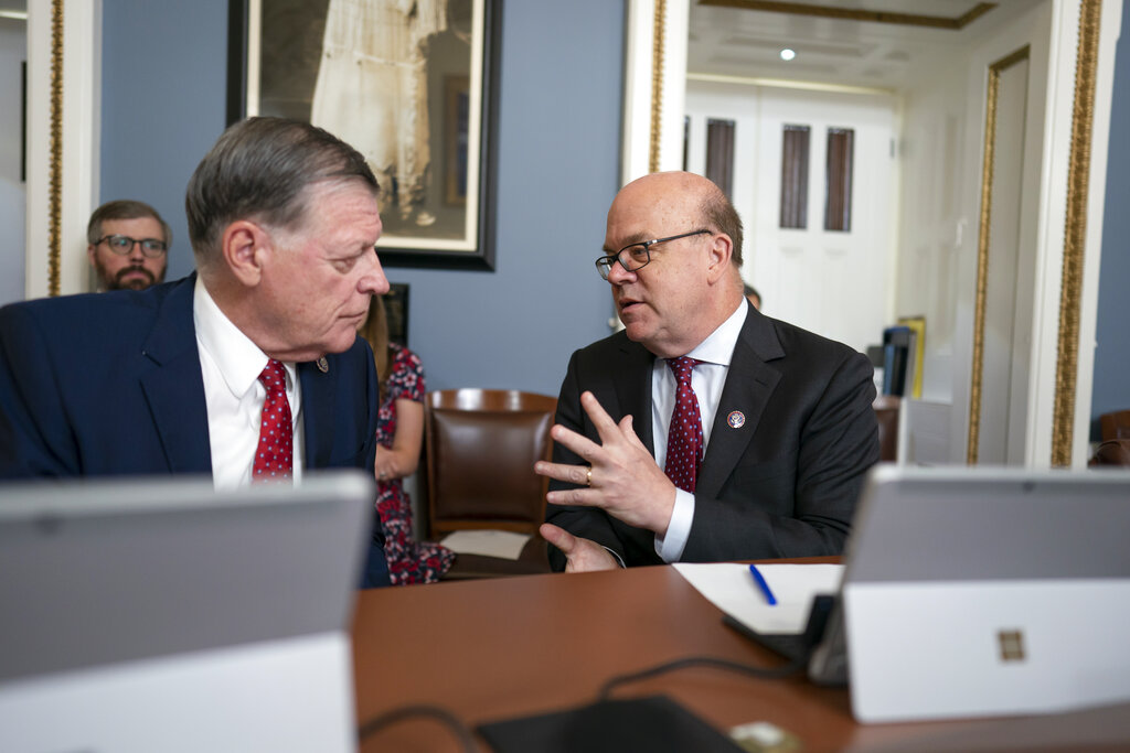 House Rules Committee Ranking Member Tom Cole, R-Okla., left, and Chairman Jim McGovern, D-Mass., confer as the panel prepares to advance a Democratic gun control bill to the floor, the Protecting Our Kids Act, in response to the recent mass shootings in Texas and New York, at the Capitol in Washington, Tuesday, June 7, 2022. (AP Photo/J. Scott Applewhite)