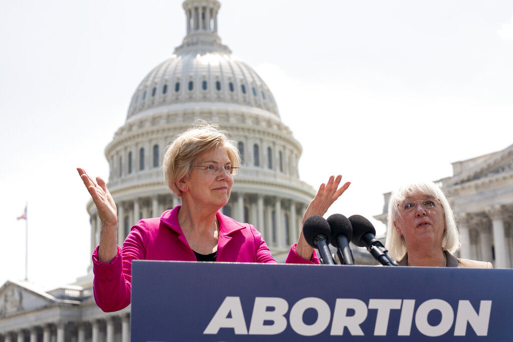 Sen. Elizabeth Warren, D-Mass., and Sen. Patty Murray, D-Wash., express their frustration during a news conference as the Supreme Court is poised to possibly overturn Roe v. Wade and urge President Joe Biden to use his executive authority to protect abortion rights, at the Capitol in Washington, Wednesday, June 15, 2022. (AP Photo/J. Scott Applewhite)
