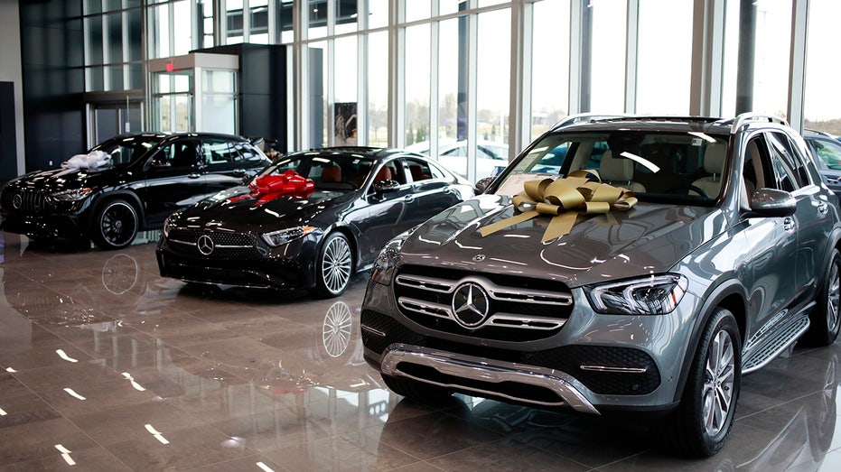 Mercedes vehicles sit inside a showroom