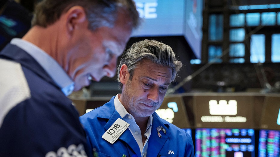 Traders working on floor of NYSE