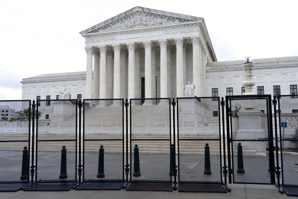 Anti-scaling fencing is seen outside the Supreme Court, Thursday, June 23, 2022, in Washington. (AP Photo/Jacquelyn Martin)