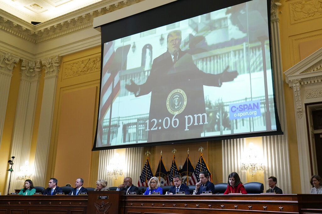 A video of former President Donald Trump at a rally near the White House on Jan. 6th, is shown as committee members from left to right, Rep. Stephanie Murphy, D-Fla., Rep. Pete Aguilar, D-Calif., Rep. Adam Schiff, D-Calif., Rep. Zoe Lofgren, D-Calif., Chairman Bennie Thompson, D-Miss., Vice Chair Liz Cheney, R-Wyo., Rep. Adam Kinzinger, R-Ill., Rep. Jamie Raskin, D-Md., and Rep. Elaine Luria, D-Va., look on, as the House select committee investigating the Jan. 6 attack on the U.S. Capitol holds its first public hearing to reveal the findings of a year-long investigation, at the Capitol in Washington, Thursday, June 9, 2022. (AP Photo/J. Scott Applewhite)