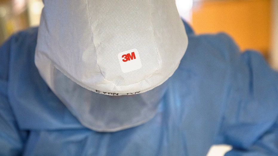 A 3M logo on a respirator hood