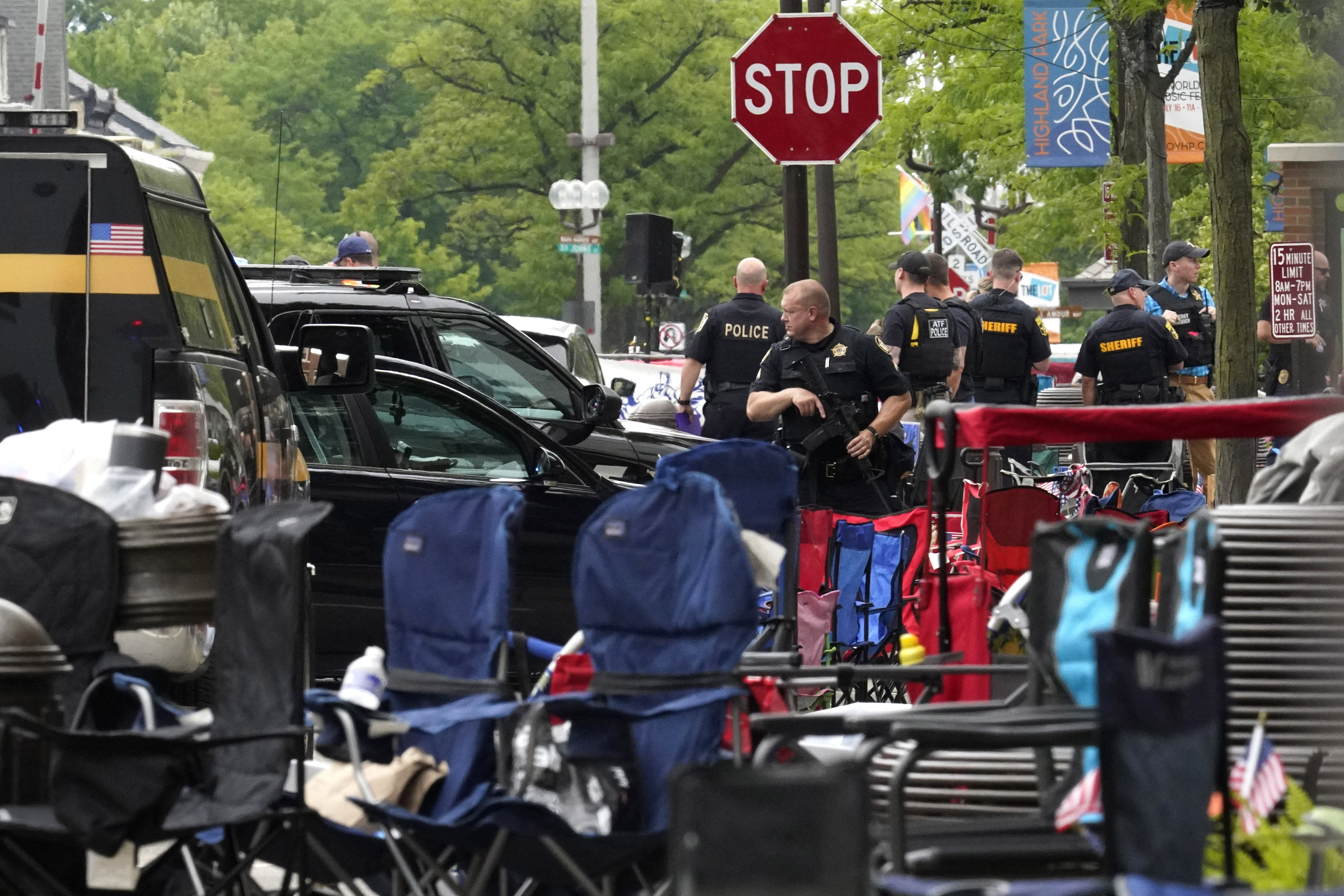 Law enforcement search after a mass shooting at the Highland Park Fourth of July parade in downtown Highland Park, Ill., a suburb of Chicago, Monday, July 4, 2022. (AP Photo/Nam Y. Huh)