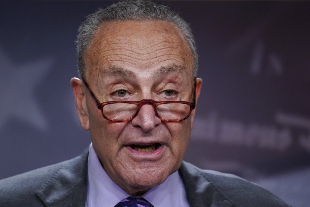 Senate Majority Leader Chuck Schumer, D-N.Y., speaks with reporters following a closed-door caucus lunch, at the Capitol in Washington, Tuesday, July 19, 2022. (AP Photo/J. Scott Applewhite)
