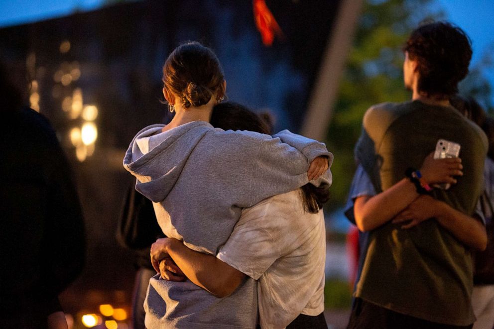 PHOTO: People gather for a candelight vigil near the scene of a mass shooting yesterday at a Fourth of July parade, on July 5, 2022 in Highland Park, Ill.