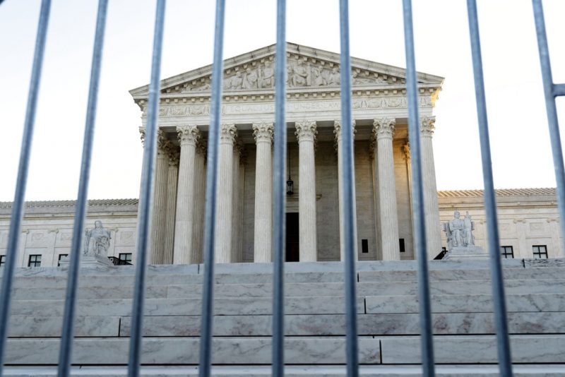 The U.S. Supreme Court is seen through a metal baracade on Capitol Hill in Washington, Wednesday, Nov. 3, 2021. The Supreme Court is set to hear arguments in a gun rights case that centers on New York’s restrictive gun permit law and whether limits the state has placed on carrying a gun in public violate the Second Amendment. (AP Photo/Jose Luis Magana)